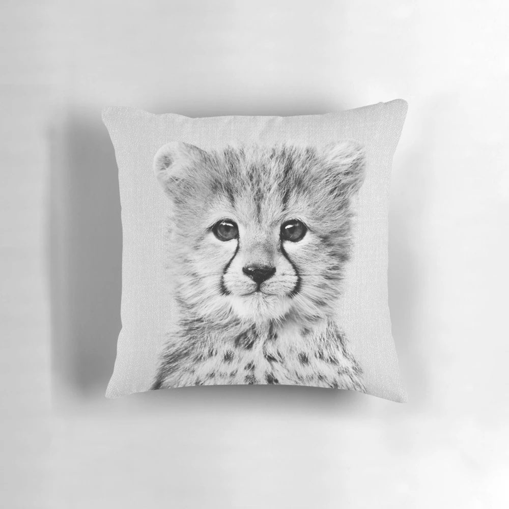 Striking black and white portrait of a baby cheetah, perfect for a modern nursery or home.
