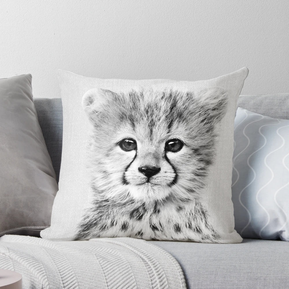Striking black and white portrait of a baby cheetah, perfect for a modern nursery or home.