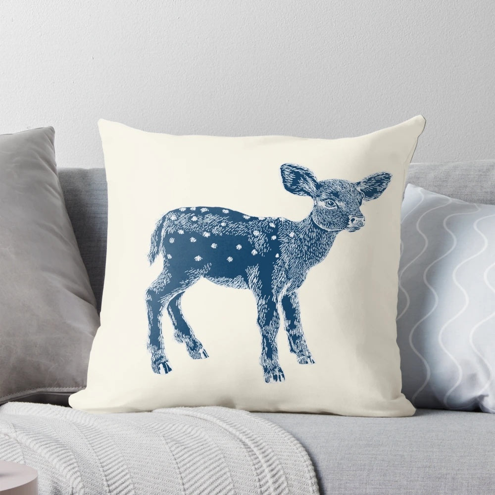 Decorative indigo and cream pillow featuring a cute baby deer illustration