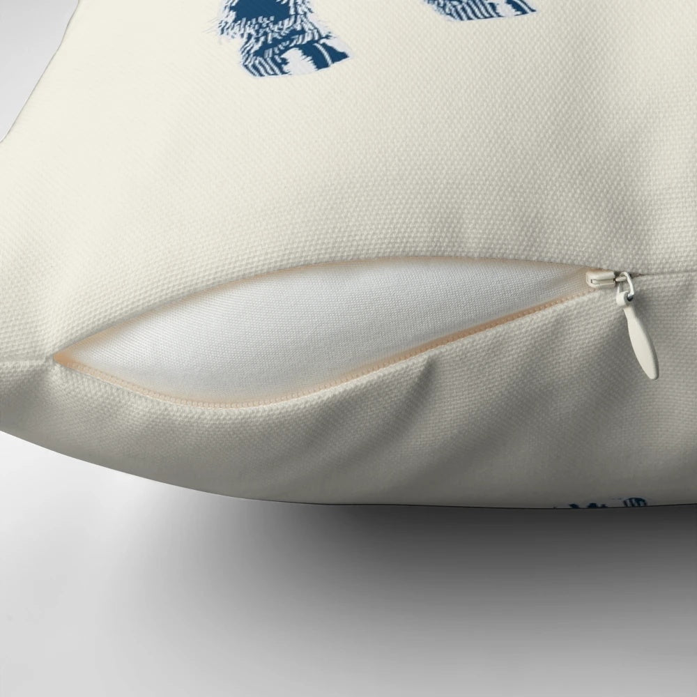 Decorative indigo and cream pillow featuring a cute baby deer illustration
