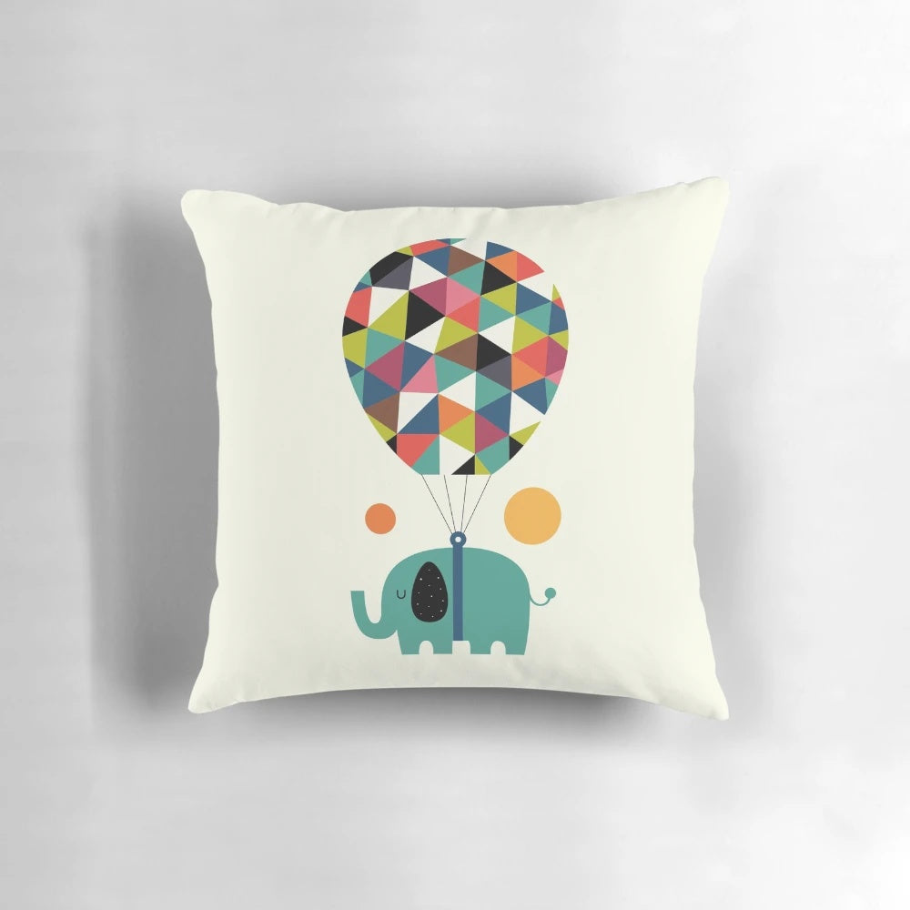 Colorful baby elephant pillow with rainbow design, perfect for kids' room or nursery