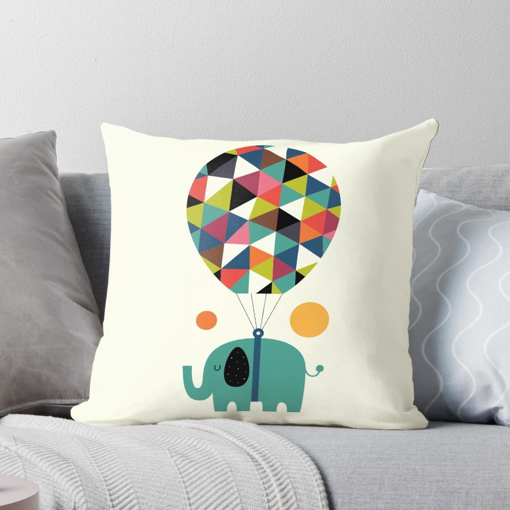 Colorful baby elephant pillow with rainbow design, perfect for kids' room or nursery