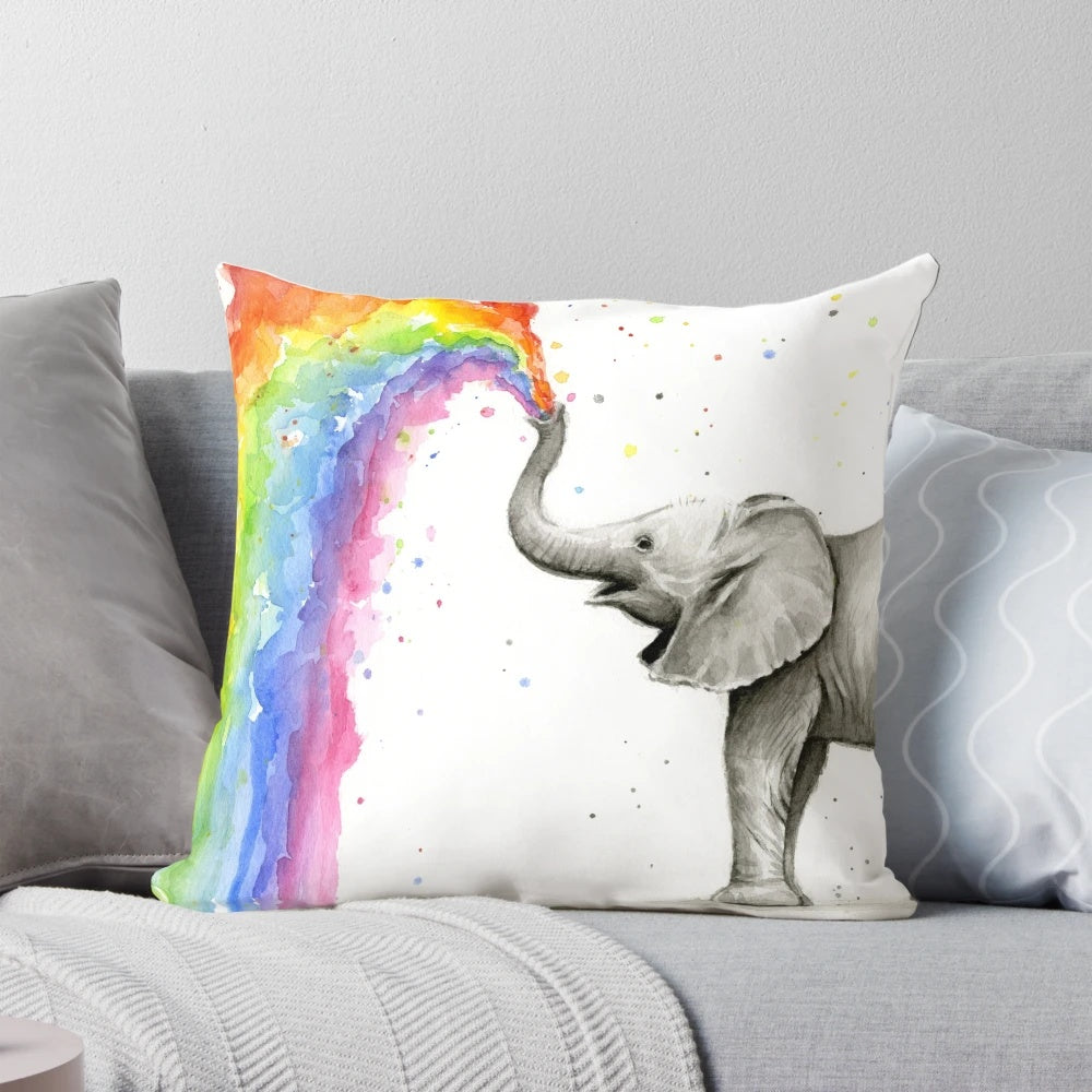 Illustrated baby elephant spraying a vibrant rainbow
