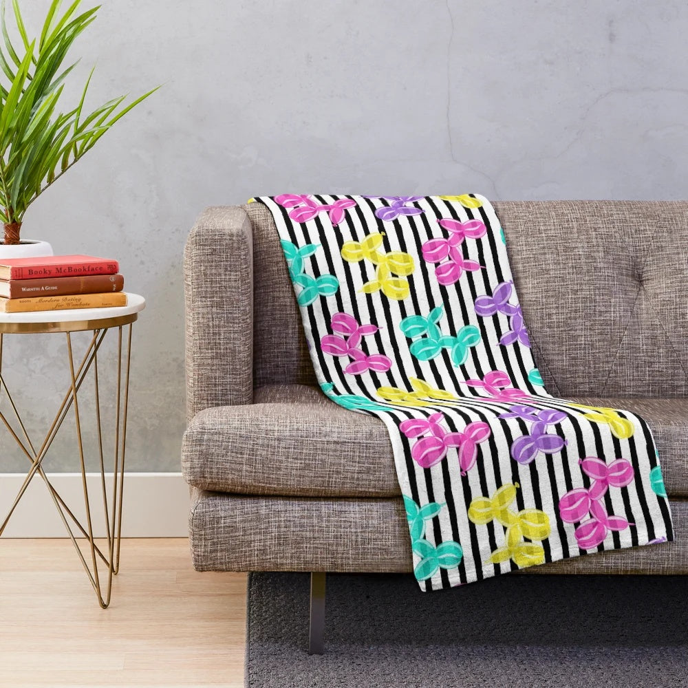 Colorful balloon dog plush blanket with black and white striped pattern