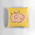 Closeup of a soft, plush pillow in the shape of a cute, chibi-style banana-colored pig.