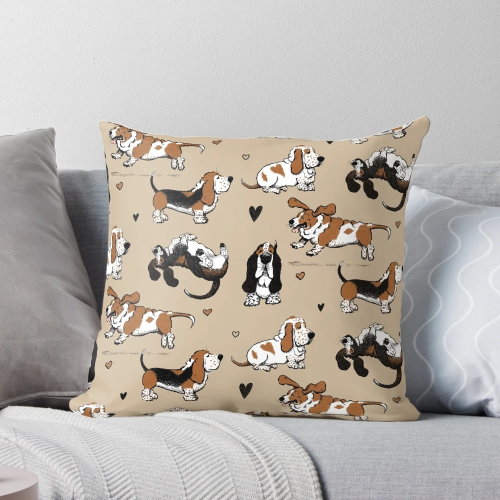 Pair of Basset Hound puppies cuddling on a tan pillow