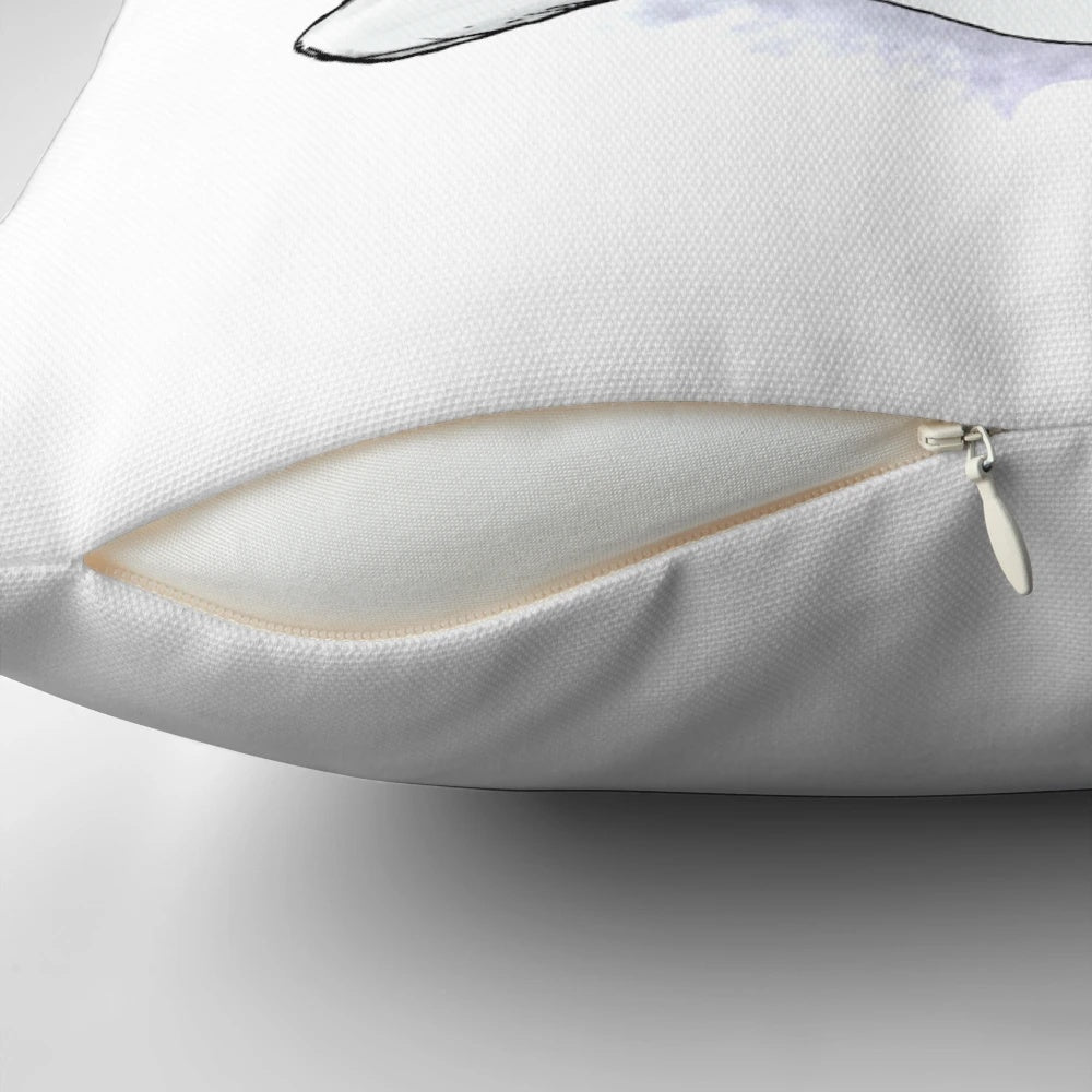 Watercolor illustration of a cute baby beluga whale on a soft, white pillow