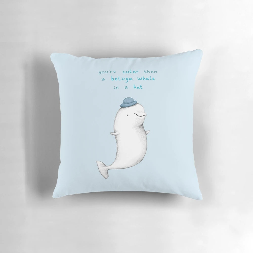 A soft, plush pillow featuring the adorable face of a beluga whale.