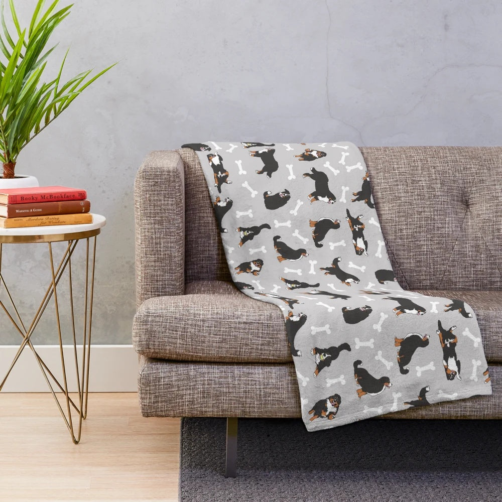 Bernese mountain dog plush blanket with a gray background