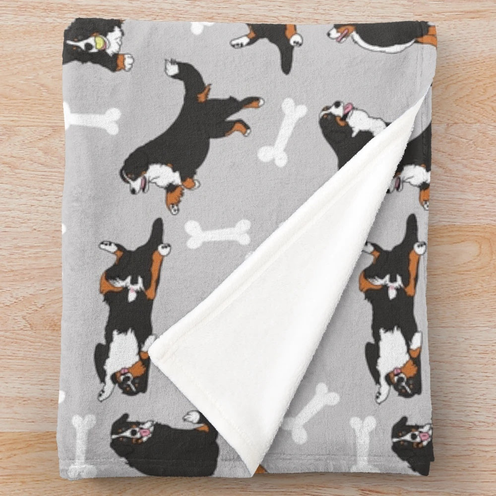 Bernese mountain dog plush blanket with a gray background