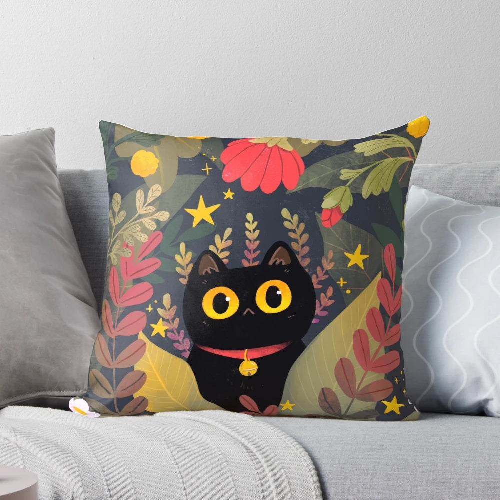 Decorative throw pillow featuring a cute black cat with big eyes surrounded by floral and plant designs
