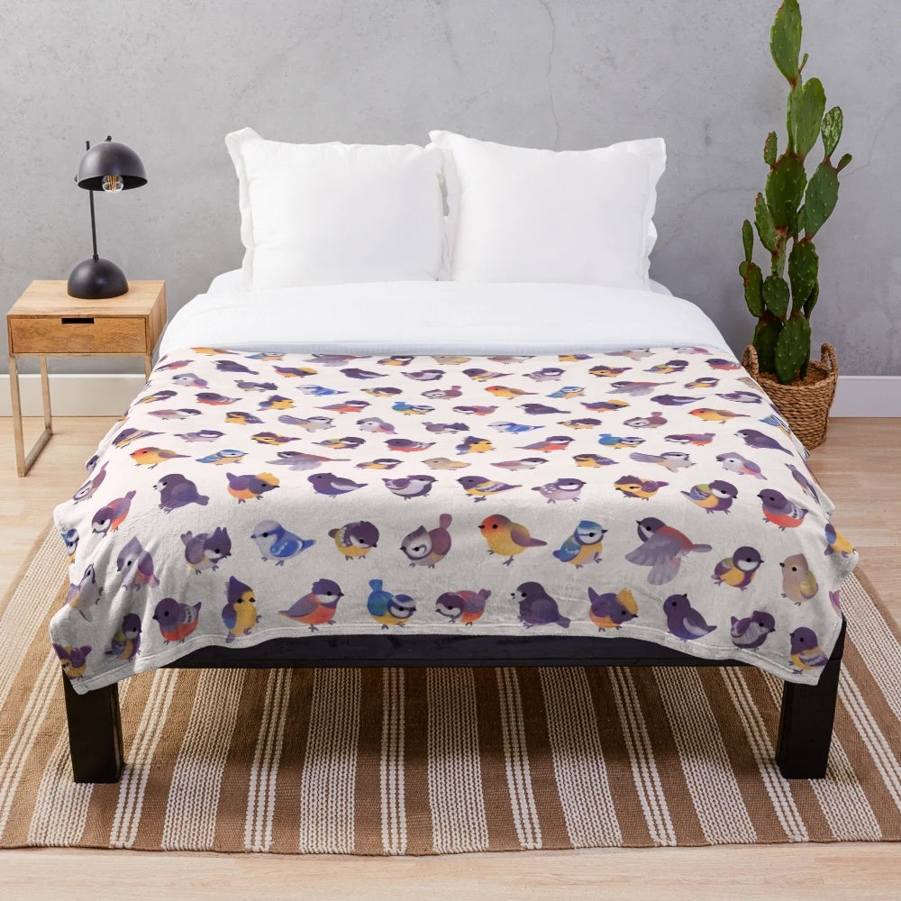 Soft, plush blanket featuring a delightful bird design, perfect for snuggling up.