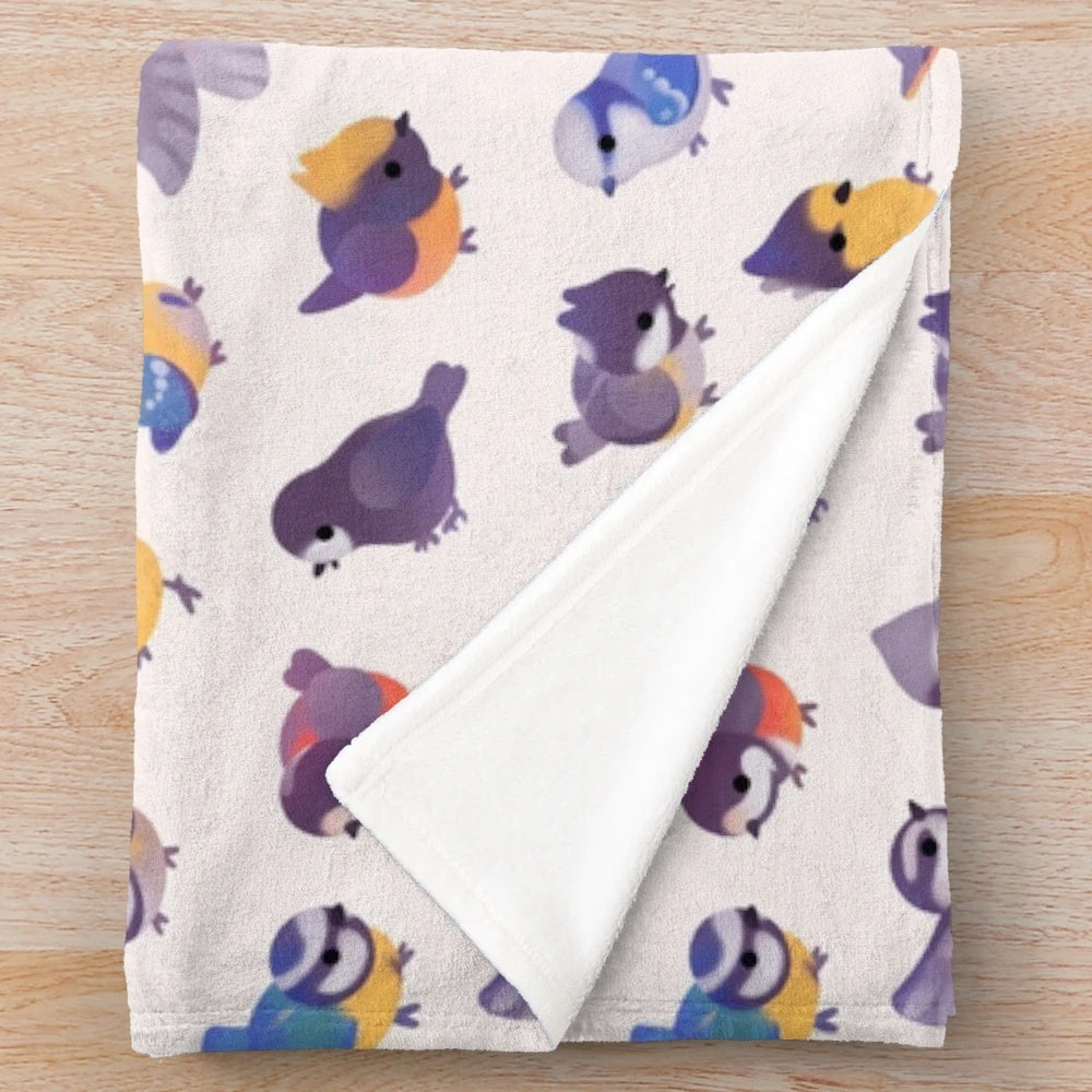 Soft, plush blanket featuring a delightful bird design, perfect for snuggling up.