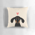 Cute dachshund puppy lying on a heart-shaped pillow
