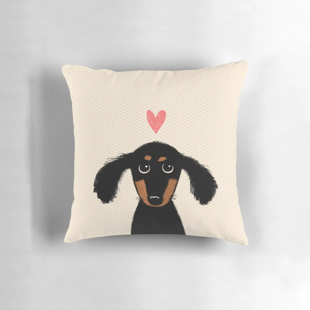 Cute dachshund puppy lying on a heart-shaped pillow
