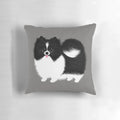Black and white Pomeranian plush pillow, a soft and cuddly dog-themed home decor item.