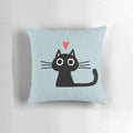Soft, heart-shaped pillow featuring an illustration of a cute black cat kitten for Valentine's Day