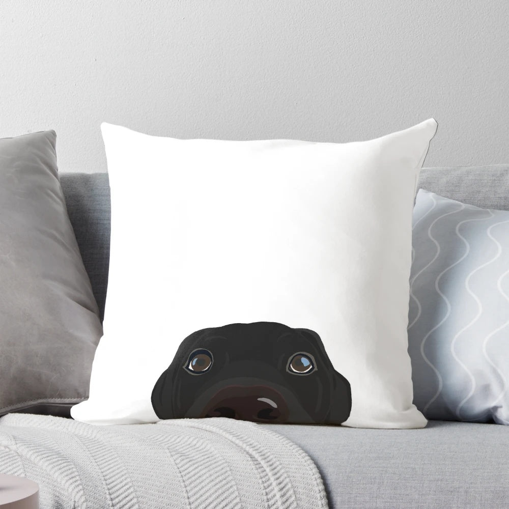 Soft, plush pillow featuring a curious and cute black labrador retriever puppy