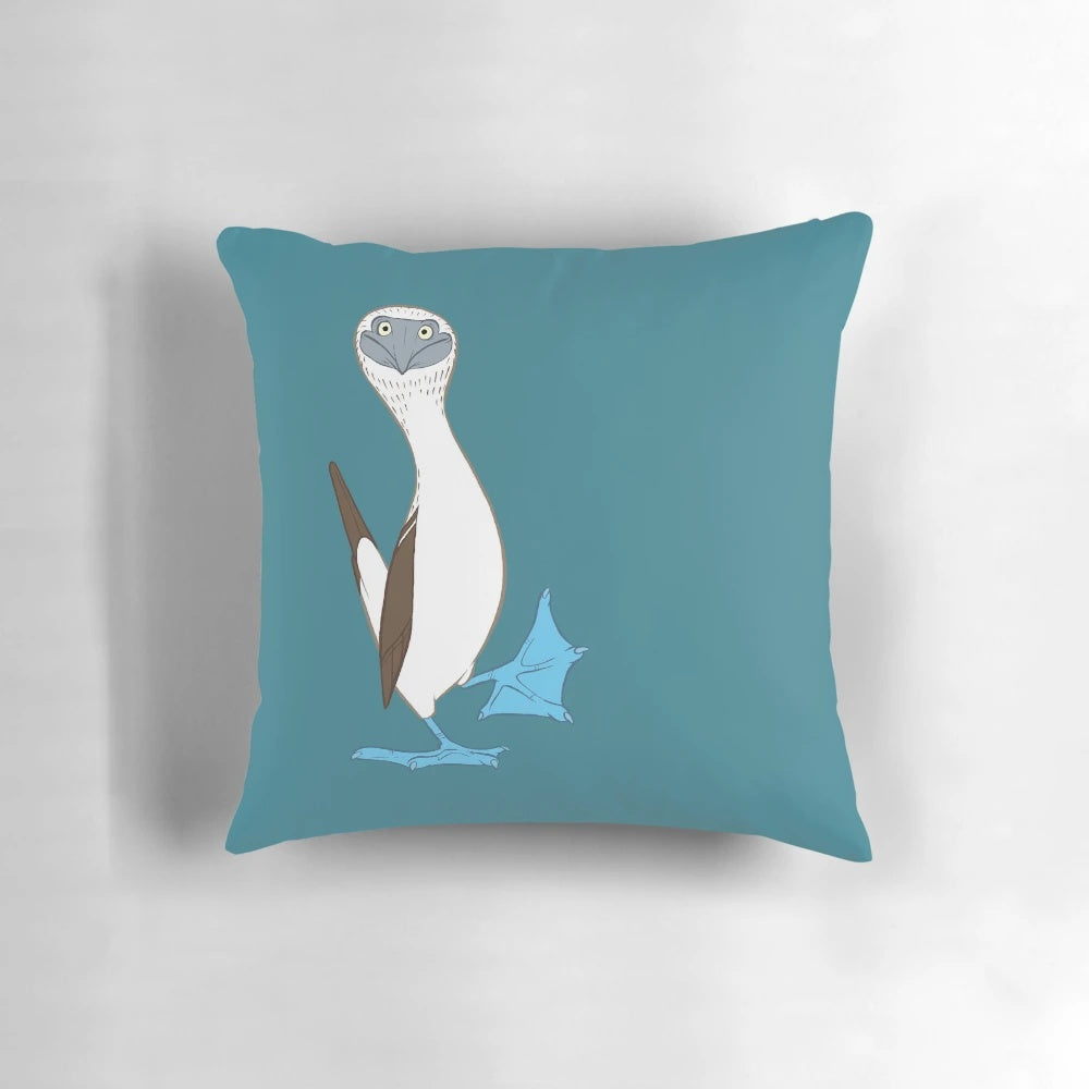 Colorful cartoon image of a blue-footed booby bird on a fluffy white pillow
