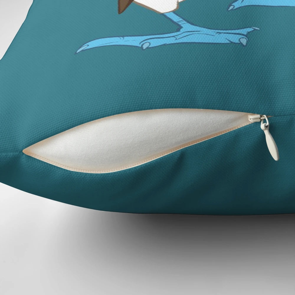 Colorful cartoon image of a blue-footed booby bird on a fluffy white pillow