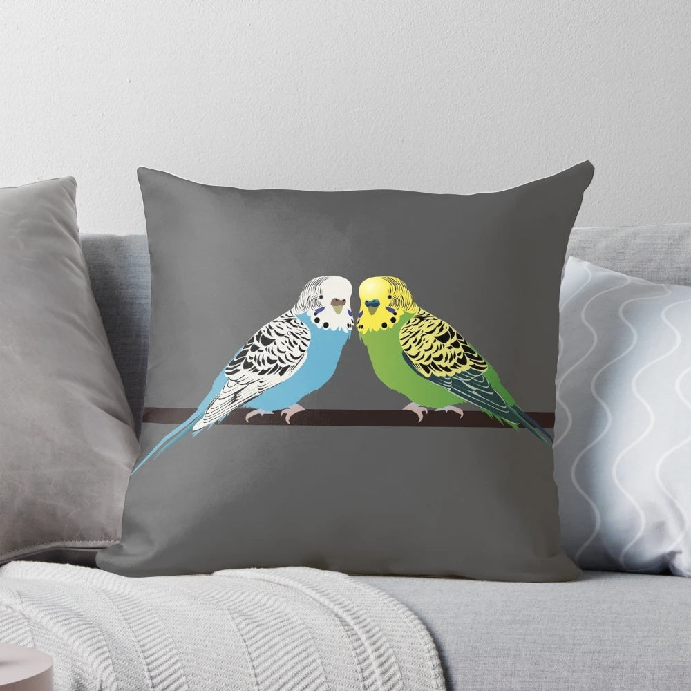 Closeup image of a blue parakeet on a decorative pillow