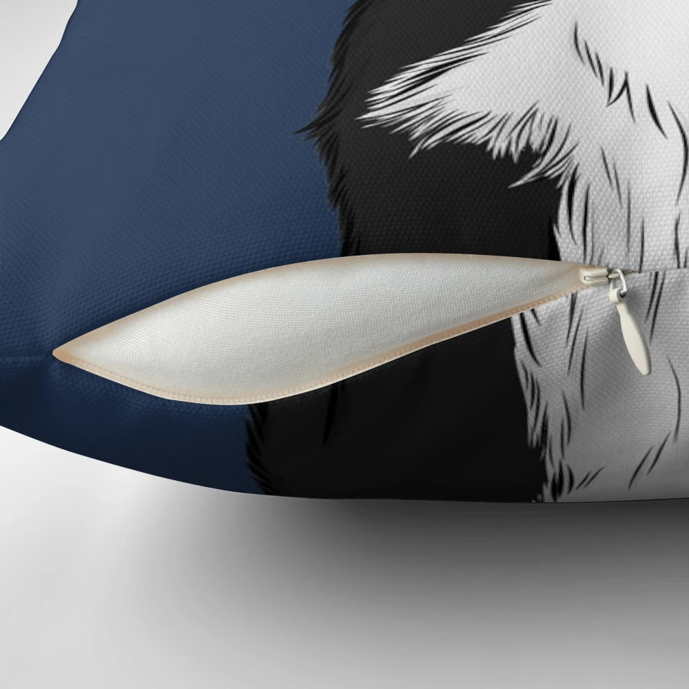 A cute black and white border collie dog illustration on a decorative pillow.