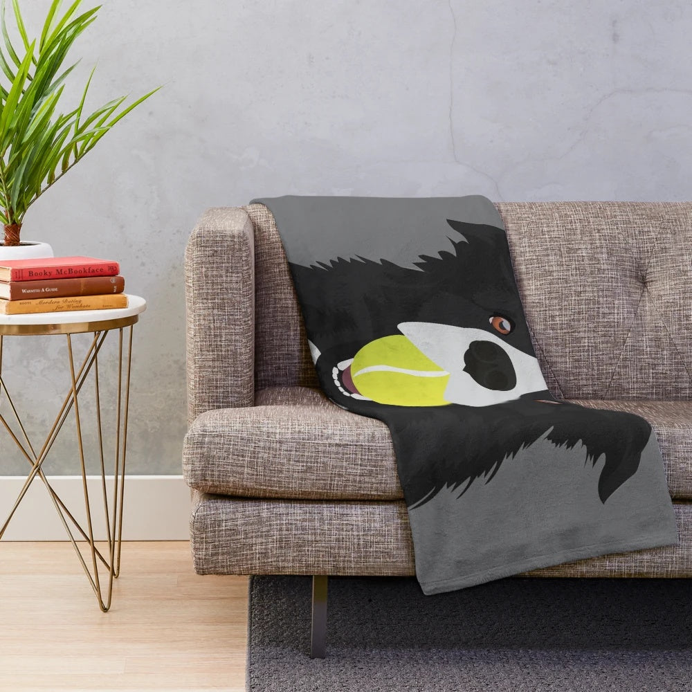 Cozy border collie plush blanket with a tennis ball