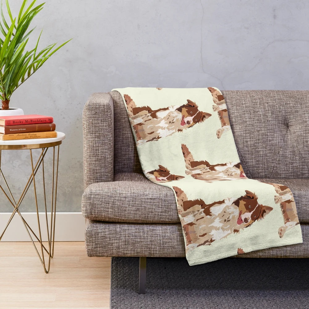 Cute and cuddly border collie dog on a plush blanket