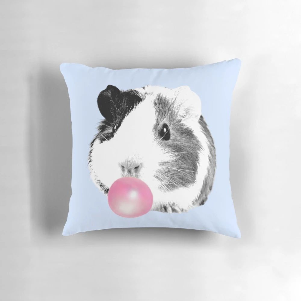 Soft, cuddly guinea pig pillow in bubble gum pink color, perfect for kids' rooms and nurseries.