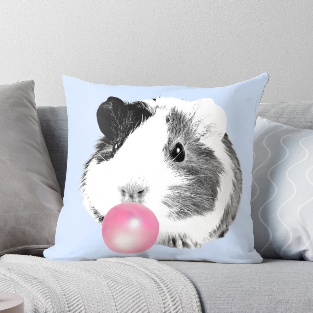 Soft, cuddly guinea pig pillow in bubble gum pink color, perfect for kids' rooms and nurseries.