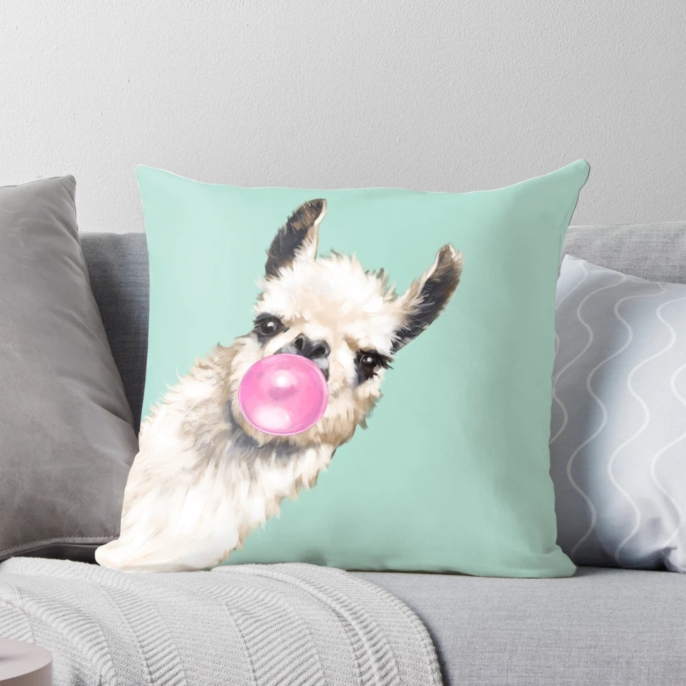 Colorful throw pillow featuring a whimsical llama with a bubble gum detail