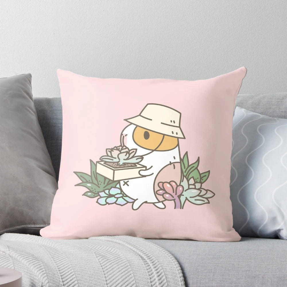 Bubu the guinea pig illustrated on a pink and green succulent-patterned pillow