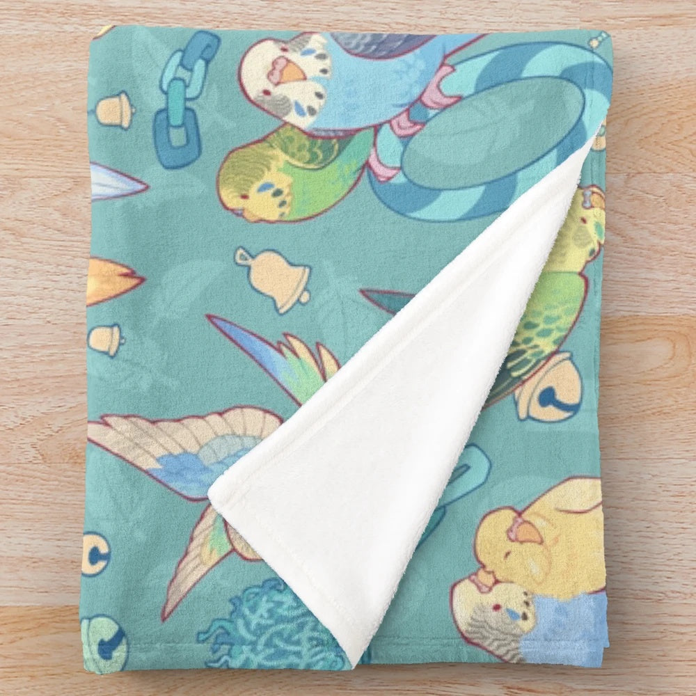 Soft and cuddly plush blanket with a cute budgie bird pattern in teal and blue shades