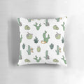 Colorful pillow featuring cute cats among cacti plants