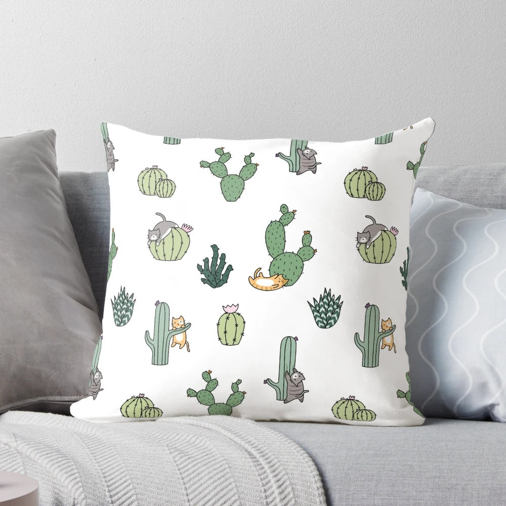 Colorful pillow featuring cute cats among cacti plants