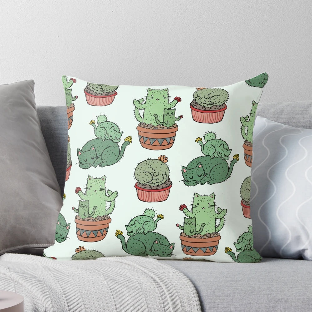 Cozy pillow featuring a playful design of cats among cactus plants