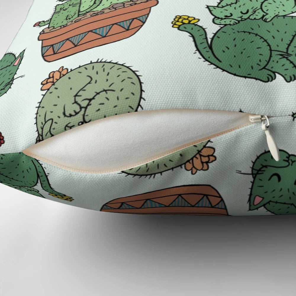 Cozy pillow featuring a playful design of cats among cactus plants
