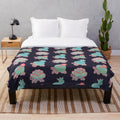 Plush cactus tortoise blanket with a cute, smiling design