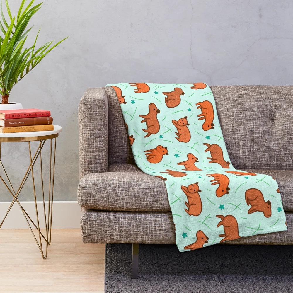 Capybara patterned plush blanket providing soft, warm, and snuggly comfort
