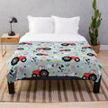 Cute kids plush blanket featuring red tractor and farm animals