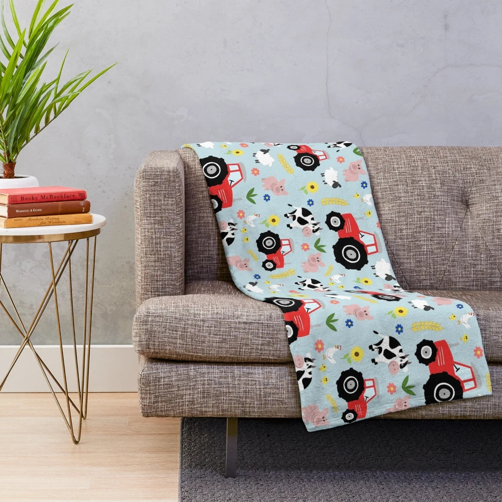 Cute kids plush blanket featuring red tractor and farm animals
