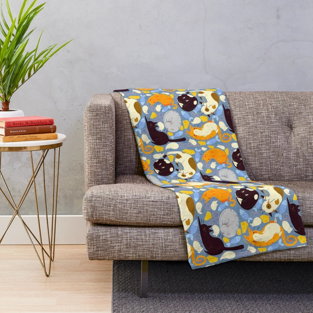 Soft and cuddly plush blanket with a charming cat and mouse pattern design