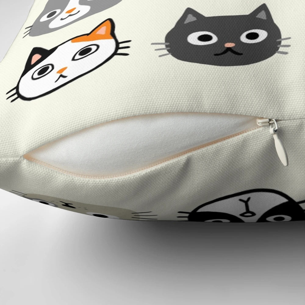Assorted cat face illustrations printed on a fluffy throw pillow, featuring various cat breeds and patterns