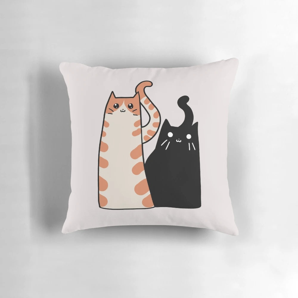 Soft, plush pillow with a design featuring an orange tabby cat and a black cat, perfect for cat lovers.