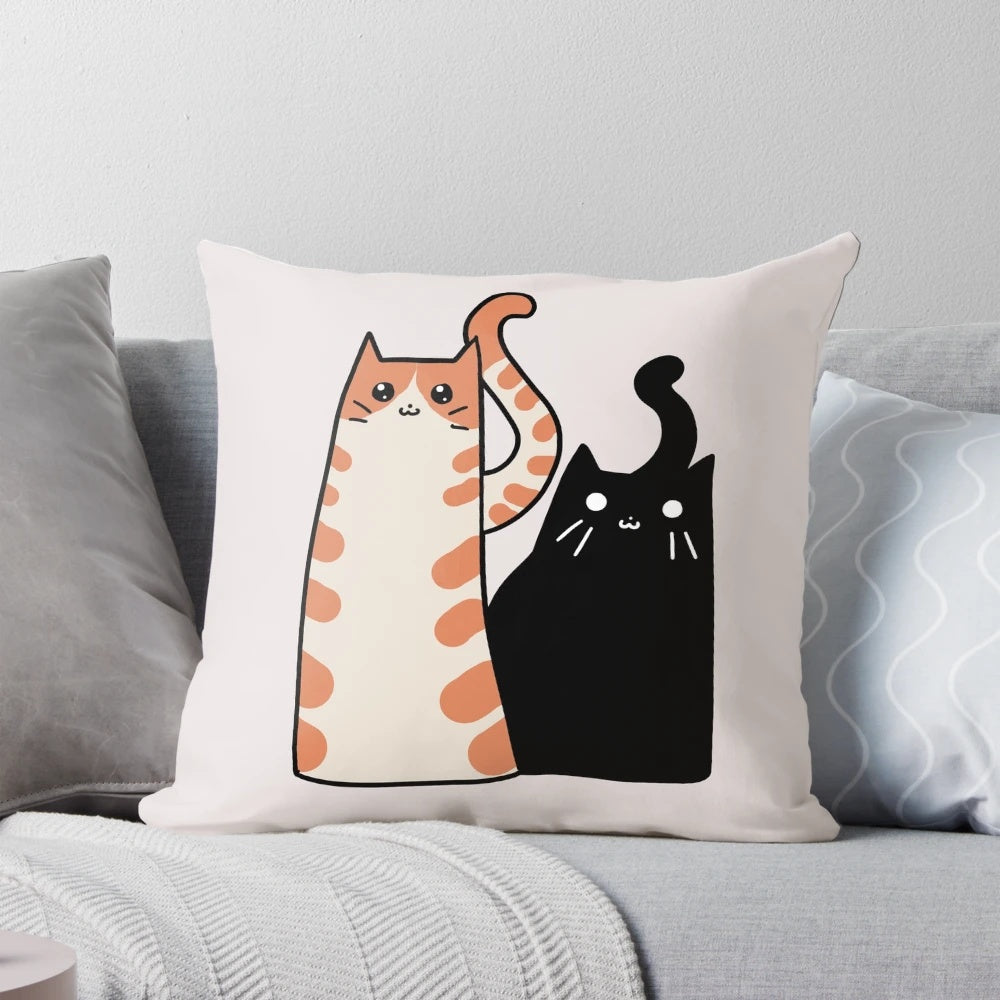 Soft, plush pillow with a design featuring an orange tabby cat and a black cat, perfect for cat lovers.