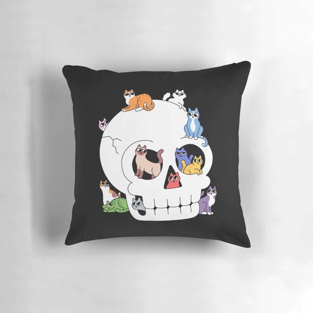 Whimsical throw pillow featuring a cute cat face peeking out of a skull, perfect for cat lovers