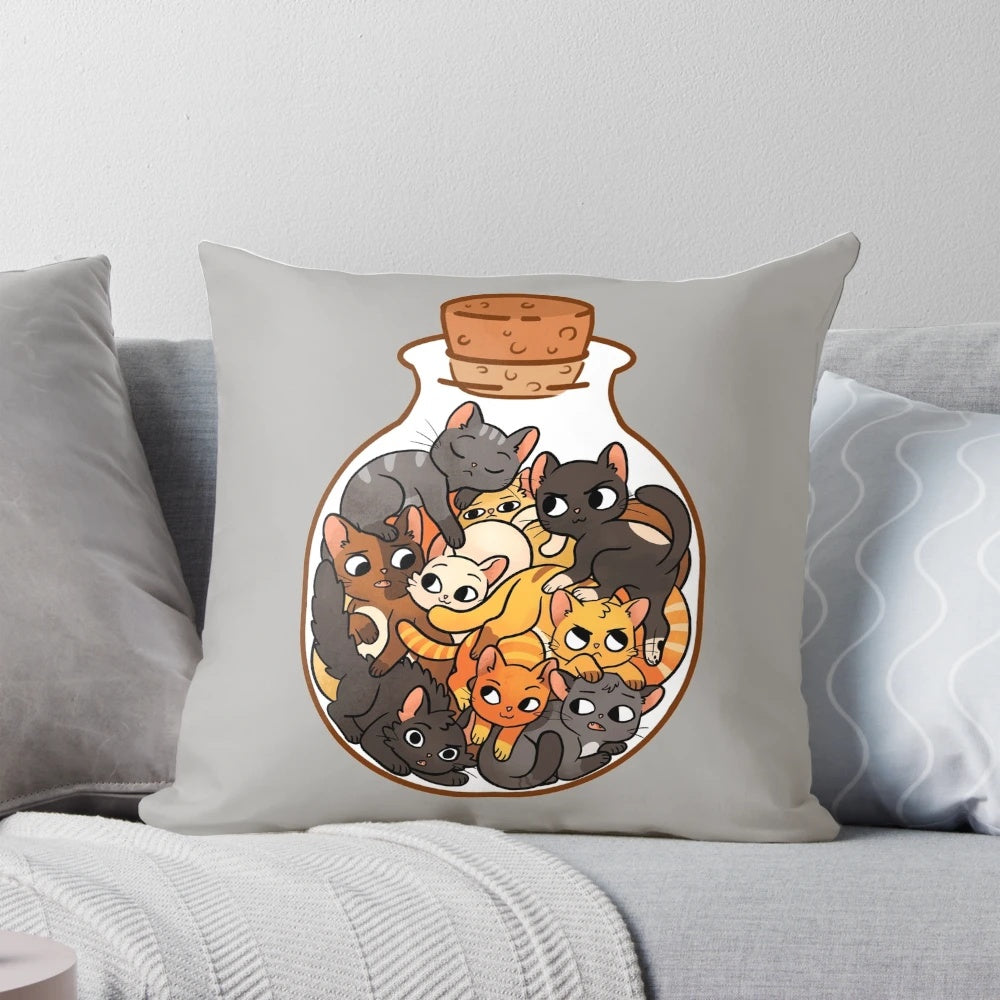 Decorative pillow with an illustration of cute tabby cats inside a glass jar