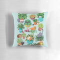 Cute black and tabby cats sitting in a variety of plants on a decorative pillow
