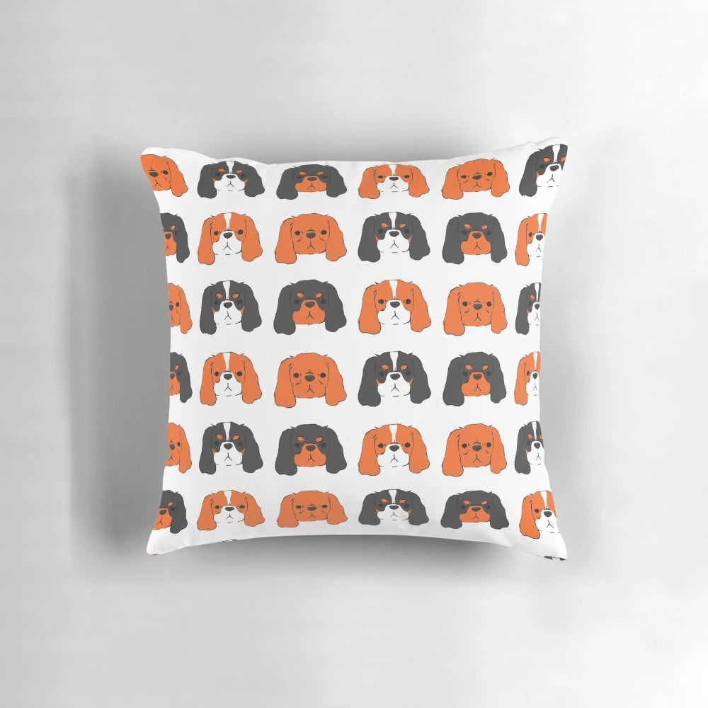 A plush, soft pillow featuring a cute Cavalier King Charles Spaniel in Blenheim, tri-color, ruby, and black and tan coat patterns.