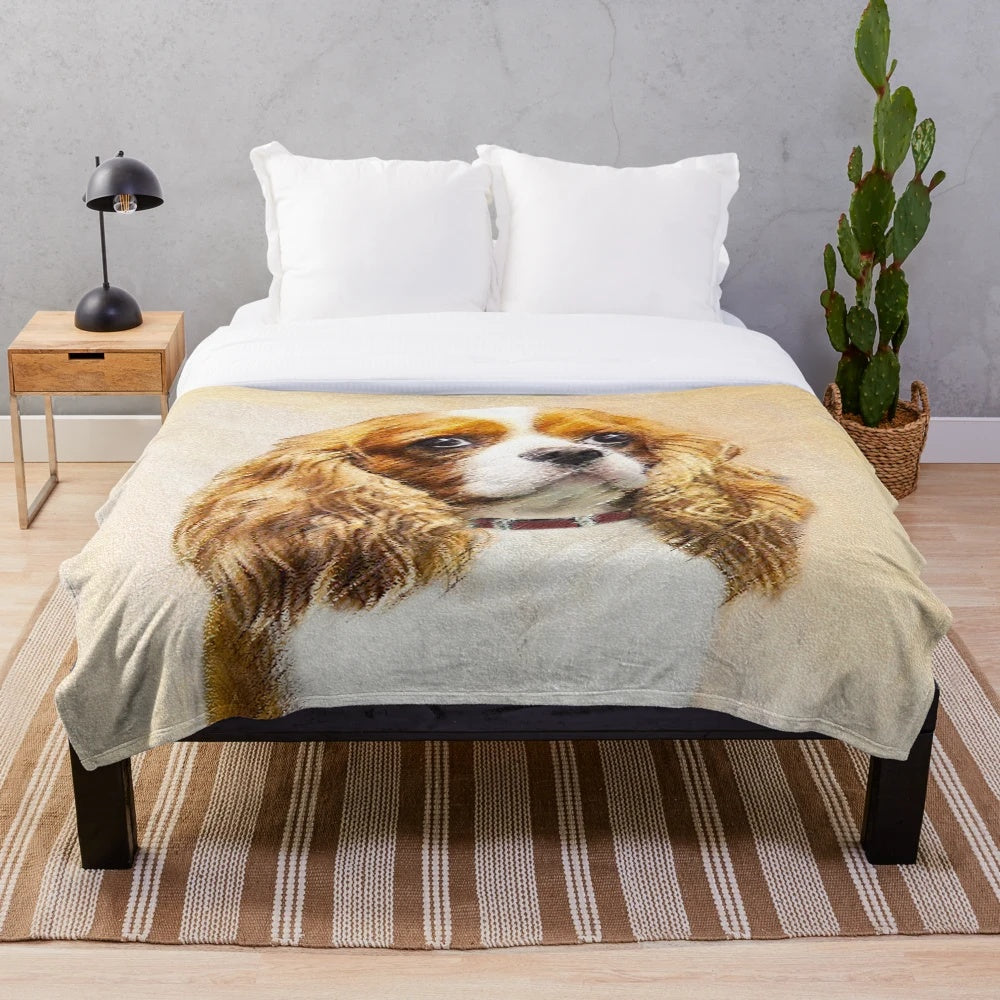 Cavalier King Charles Spaniel dog breed portrait on a plush blanket